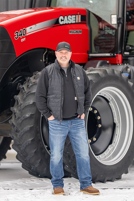 Mark infront of a Case IH Tractor